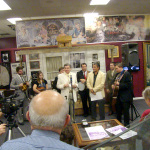 Larry Sparks speaks with the media at the unveiling of the ACMA Sparks exhibit