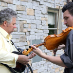 Jeff Parker and B.J. Cherryholmes warming up before their Dailey & Vincent set at Lil John Bluegrass Festival - photo © 2012 by Laura Tate Photography