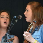 Sisters Charli Robertson and Kelsi Harrigill with Flatt Lonesome at the Emerging Artist mega-jam at the 2014 Milan Bluegrass Festival (8/16/14) - photo by Bill Warren