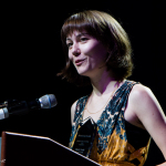 Molly Tuttle accepts her Instrumentalist Momentum Awards at the 2016 World of Bluegrass convention - photo © Tara Linhardt
