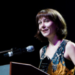 Molly Tuttle accepts her Instrumentalist Momentum Awards at the 2016 World of Bluegrass convention - photo © Tara Linhardt