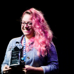 Melody Walker accepts her Vocalist Momentum Awards at the 2016 World of Bluegrass convention - photo © Tara Linhardt