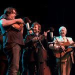 Jeff Austin with Del McCoury Band at Mumford & Sons' Gentlemen of the Road tour stop in Guthrie, OK (September 2013) - photo by Tom Dunning