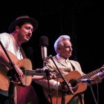Marcus Mumford sings with Del McCoury at Mumford & Sons' Gentlemen of the Road tour stop in Guthrie, OK (September 2013) - photo by Tom Dunning