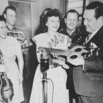Jane Claar holding her F5 while Patsy Montana receives the key to the city of York