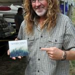 Mike Andes poses with the new Nothin' Fancy CD at the 2016 Nothin' Fancy Festival - photo © Bill Warren