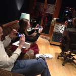 Forrest and Maggie O'Connor snap a photo of Mark O'Connor snapping a pic in the studio with The O'Connor Family Band