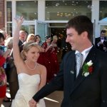 Mr. and Mrs. Christopher Boyd walking up the aisle, posed, leaving for their honeymoon - photo by Ted Lehmann
