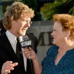 Sam Bush with Katy Daley on the 2013 IBMA Red Carpet - photo by Milo Farineau