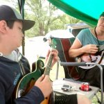 RockyGrass Academy Kids Camp instructor K.C. Groves spends some downtime with Eli, 13, who studied with the Advanced Mandolin class in the adult Academy - photo by Shannon Turner