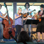 For the Kids Camp concert finale on Thursday afternoon, 11 year-old Hannah sang and played her original composition, “The Evergreen Tree,” with her back-up band of instructors at RockyGrass 2013 - photo by Shannon Turner