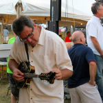Vince Gill tuning up before his set at ROMP 2012 - photo by Terry Herd