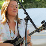 Jenny Lynn Gardner with Della Mae at ROMP 2013 - photo by Terry Herd