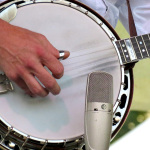 Sammy Shelor bearing down with Lonesome River Band at ROMP 2012 - photo by Terry Herd