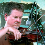 Mike Hartgrove with Lonesome River Band at ROMP 2012 - photo by Terry Herd