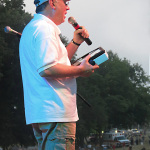 Terry Herd announcing the winner of a new iPad from Bluegrass Today at ROMP 2012 - photo by Woody Edwards