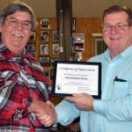 Bill Warren presents a certificate of appreciation to Milan Bluegrass Festival at the Southeast Michigan Bluegrass Music Association December 2014 meeting - photo by Bill Warren