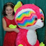 Caroline Williamson with her rainbow bear at the 2016 Christmas in the Smokies festival in Pigeon Forge, TN - photo © Bill Warren