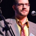 Daniel Mullins MCs at the 2013 SOIMF - photo by Bill Warren