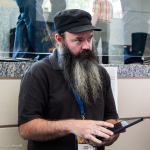 Soundman Jesse Stover hard at work at The Masters Workshop stage at the 2016 World of Bluegrass - photo by Tara Linhardt