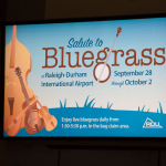 Welcome bluegrass sign at the Raleigh Airport - photo © Tara Linhardt