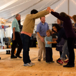 Square dance in the dance tent at the 2015 Wide Open Bluegrass Festival - photo by Tara Linhardt