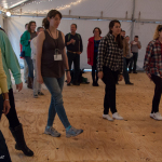 Clogging students in the dance tent at the 2015 Wide Open Bluegrass Festival - photo by Tara Linhardt
