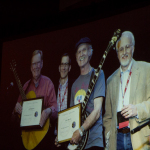 Photos displayed during the presentation of Jim Rooney's Distinguished Achievement Award at the 2016 Wold of Bluegrass - photo © Tara Linhardt