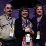 Howard Parker and Debbie Terry Durant accepting the Event of the Year Award from Kimberly Williams at the Special Awards at the 2016 Wold of Bluegrass - photo © Tara Linhardt