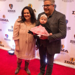 Kenny, Amanda, and Annabelle Smith on the red carpet at the 2015 IBMA Awards Show - photo © Todd Powers