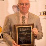 Steve Martin with his 2015 Distinguished Achievement Award at World of Bluegrass 2015 - photo © Todd Powers