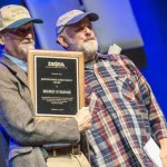 Ken Irwin accepts the