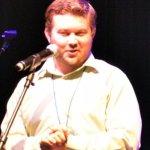 Danny Clark accepts his 2013 Momentum Award at World of Bluegrass - photo by Bill Warren