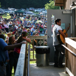 Lucas White heading for the stage at the 2013 Wayne Henderson Festival - photo by Andy Garrigue