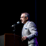 Loren Gold, VP of Greater Raleigh Convention and Visitors Bureau, discussed how happy they were to have IBMA again in Raleigh - photo © Tara Linhardt