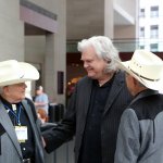 The Ozaki Brothers talk bluegrass with Ricky Skaggs at World of Bluegrass 2013 - photo by Tar Linhardt