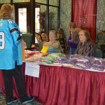 Lorraine Jordan checks in at the welcome desk at the 2015 Christmas in the Smokies Bluegrass Festival