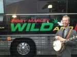 Graham Sharp poses by Ziggy Marley's bus