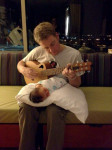 Travis Book serenades his newborn daughter, Ruby, in the hospital