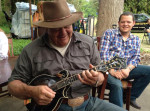 Balsam Range's Caleb Smith watches Paul Sorvino playing mandolin on the set of Careful What You Wish For - April 2013