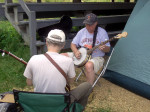 Bruce Stockwell (left) works with a banjo student at Jenny Brook 2013 - photo by Dick Bowden