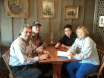 Tim White, Cory Hemilright, John Locust, and Lorraine Jordan signing the deal to launch Bluegrass Circle Promotions