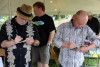 Dudley Connell and Fred Travers with Seldom Scene signing autographs at the Gettysburg Bluegrass Festival (5/17/14) - photo by David Morris