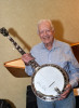 Jimmy Carter with the banjo Wayne Blythe built and donated to The Carter Center