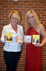 Nancy B. Brewer and Rhonda Vincent with copies of The House With The Red Light, book and CD