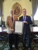 Bill Jenkins is presented with a copy of the joint resolution in his honor by Virginia Senator Tommy Norment (February  19, 2015)