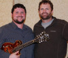Zach Rambo with his new Hook mandolin at SPBGMA 2015 with luthier Chris Shelton