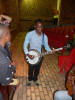 Students at the University of Rwanda have an impromptu jam session on bluegrass instruments.
