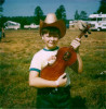 Billy Hurt holding "the olde man" when he was nine years old
