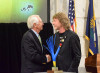 Kentucky Governor Steve Beshear presents Sam Bush with a 2015 Governor's Award in the Arts - photo by Tina White May